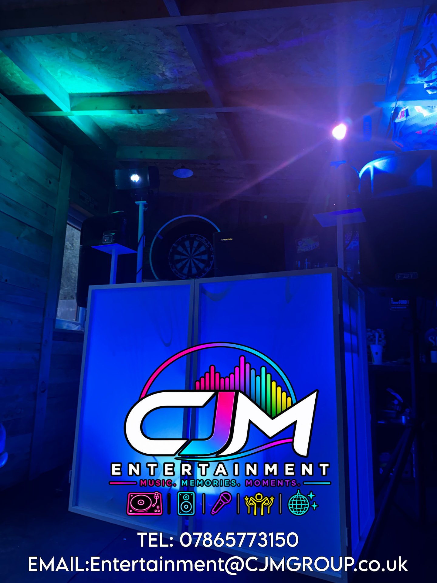 CJM Entertainment branded DJ booth with colourful lighting